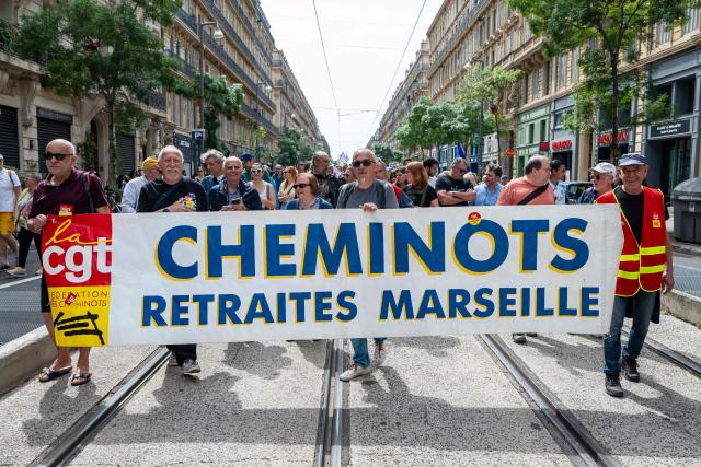 People take part in a May Day rally marking International Workers' Day in Marseille, on May 1, 2026. (Photo by MIGUEL MEDINA / AFP)
