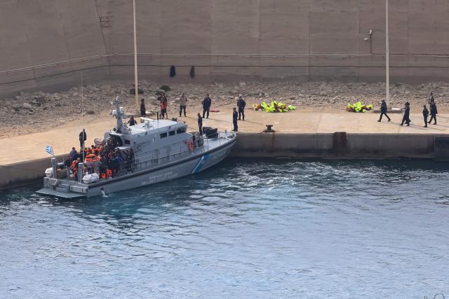 Activists from the Global Sumud Flotilla disembark from a Greek Coast Guard vessel, after being intercepted by the Israeli Navy in international waters, at the port of Atherinolakkos on the island of Crete, on May 1, 2026. (Photo by Costas METAXAKIS / AFP)