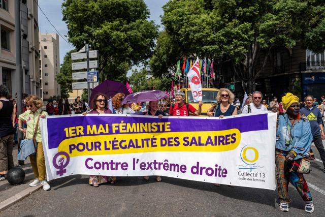 Demonstrators hold a placard reading "Feminist May Day, for equal pay, against the far right" during a May Day (Labour Day) rally, marking International Workers' Day, in Marseille, on May 1, 2026. (Photo by MIGUEL MEDINA / AFP)
