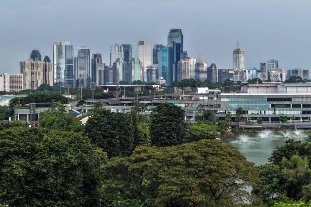 This picture shows an aerial view of Jakarta's skyline on May 1, 2026. (Photo by BAY ISMOYO / AFP)