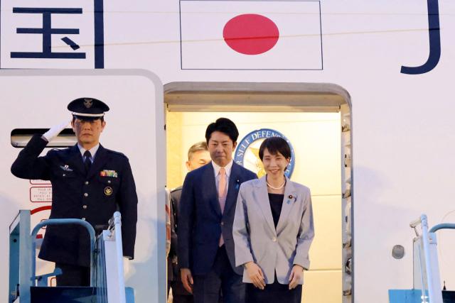 Japan's Prime Minister Sanae Takaichi (R) disembarks a plane upon arrival at Noi Bai International Airport in Hanoi on May 1, 2026. (Photo by Hoang Long / AFP)