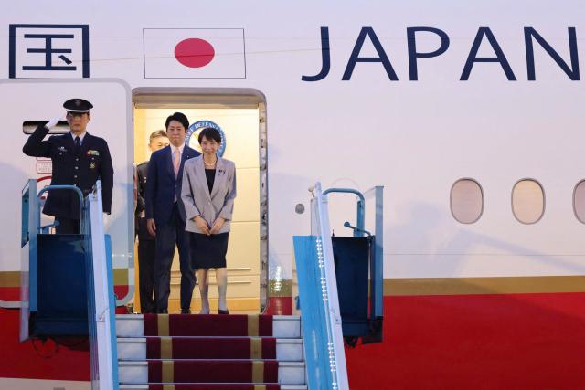 Japan's Prime Minister Sanae Takaichi (R) disembarks a plane upon arrival at Noi Bai International Airport in Hanoi on May 1, 2026. (Photo by Hoang Long / AFP)