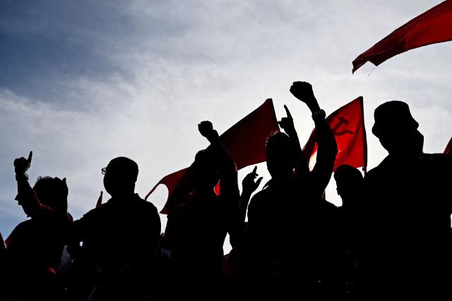 Activists and supporters of the National People's Power (NPP) party take part in a rally to mark International Labour Day in Colombo on May 1, 2026. (Photo by Ishara S. KODIKARA / AFP)