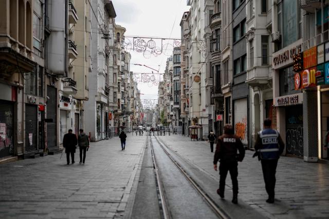 Police officers block Taksim square and Istiklal avenue using barriers during a May Day (Labour Day), marking International Workers' Day, in the Taksim district of Istanbul, on May 1, 2026. At least 370 people were arrested on May 1, 2026 during demonstrations in Istanbul curbed by a heavy police deployment, a lawyers' association present at the rallies said. (Photo by BERK OZKAN / AFP)