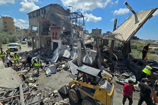 First responders search for survivors amongst the rubble at the site of an Israeli airstrike that targeted the southern Lebanese village of Ain Baal on May 1, 2026. Israeli airstrikes on southern Lebanon killed at least 17 people on April 30, 2026, the Health Ministry announced, despite the ceasefire that has been in effect since April 17. Lebanon was drawn into the Middle East war on March 2 when Tehran-backed militant group Hezbollah launched attacks on Israel to avenge the killing of the Iranian leader. Israel has responded with broad strikes across Lebanon and a ground offensive. (Photo by Kawnat HAJU / AFP)
