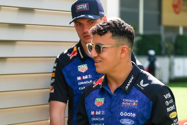 (L/R) Red Bull Racing's Dutch driver Max Verstappen and Red Bull Racing's French driver Isack Hadjar arrive ahead of a practice session for the 2026 Miami Formula One Grand Prix at Miami International Autodrome in Miami Gardens, Florida, on May 1, 2026. (Photo by CHARLY TRIBALLEAU / AFP)
