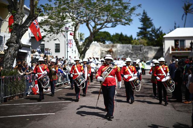 Members of the Royal Bermuda Regiment Band and Drums prepares for an arrival ceremony for King Charles III and Queen Camilla during a ceremonial welcome at King's Square in St. George's, Bermuda, on May 1, 2026. King Charles III is in Bermuda for his first visit to a British Overseas Territory as Sovereign. (Photo by Henry NICHOLLS / POOL / AFP)
