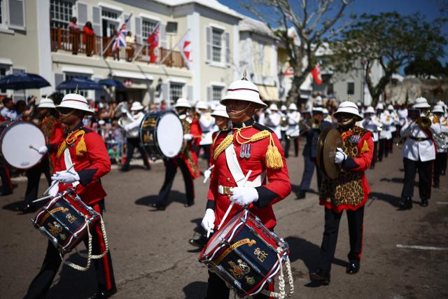 Members of the Royal Bermuda Regiment Band and Drums prepares for an arrival ceremony for King Charles III and Queen Camilla during a ceremonial welcome at King's Square in St. George's, Bermuda, on May 1, 2026. King Charles III is in Bermuda for his first visit to a British Overseas Territory as Sovereign. (Photo by HENRY NICHOLLS / POOL / AFP)