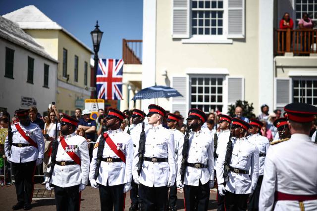 Members of the Royal Bermuda Regiment (RBR) prepare for an arrival ceremony for King Charles III and Queen Camilla during a ceremonial welcome at King's Square in St. George's, Bermuda, on May 1, 2026. King Charles III is in Bermuda for his first visit to a British Overseas Territory as Sovereign. (Photo by Henry NICHOLLS / POOL / AFP)