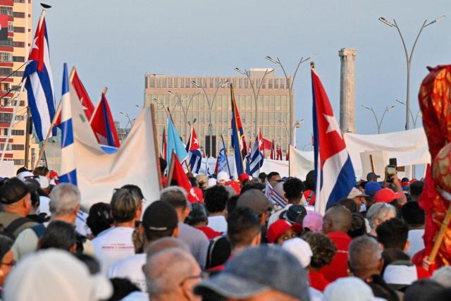 People march to mark Labor Day at the Anti-Imperialist Tribunal in front of the US Embassy in Havana on May 1, 2026. (Photo by ADALBERTO ROQUE / AFP)