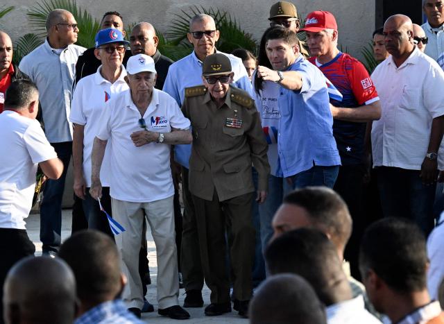 Cuba's President Miguel Diaz-Canel (2-R), former President Raul Castro (C) and former Vice-President Jose Ramon Machado Ventura (3-L) attend a May Day rally marking International Workers’ Day in Havana on May 1, 2026. (Photo by YAMIL LAGE / AFP)
