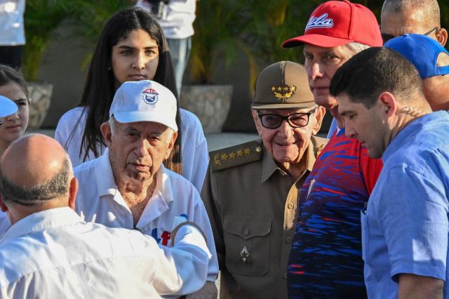 Cuba's President Miguel Diaz-Canel (2-R), former President Raul Castro (3-R) and former Vice-President Jose Ramon Machado Ventura (L) attend a May Day rally marking International Workers’ Day in Havana on May 1, 2026. (Photo by YAMIL LAGE / AFP)