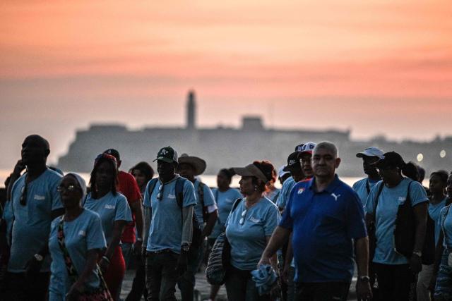 People march along Havana’s waterfront to mark International Workers’ Day at the Anti-Imperialist Platform in front of the US Embassy in Havana on May 1, 2026. (Photo by ADALBERTO ROQUE / AFP)