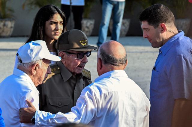 Cuba's former President Raul Castro (C) and former Vice-President Jose Ramon Machado Ventura (L) attend a May Day rally marking International Workers’ Day in Havana on May 1, 2026. (Photo by YAMIL LAGE / AFP)