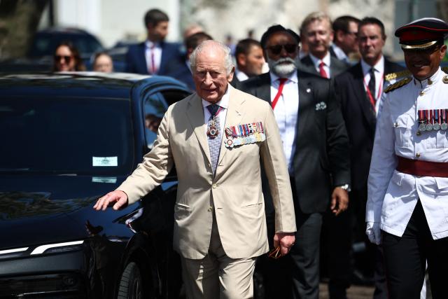 Britain's King Charles III arrives for a ceremonial welcome at King's Square in St. George's, Bermuda, on May 1, 2026. King Charles III is in Bermuda for his first visit to a British Overseas Territory as Sovereign. (Photo by Henry Nicholls / POOL / AFP)