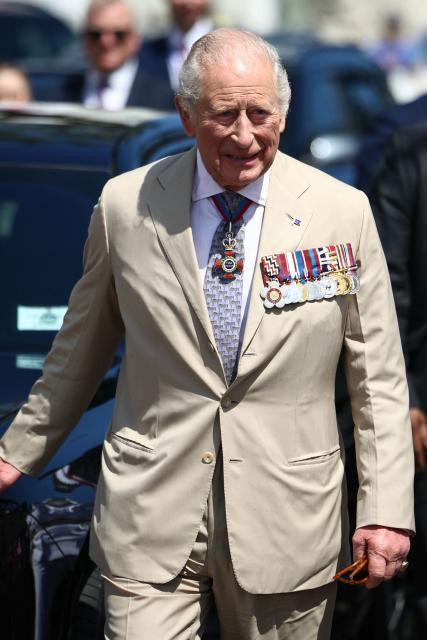 Britain's King Charles III arrives for a ceremonial welcome at King's Square in St. George's, Bermuda, on May 1, 2026. King Charles III is in Bermuda for his first visit to a British Overseas Territory as Sovereign. (Photo by Henry Nicholls / POOL / AFP)