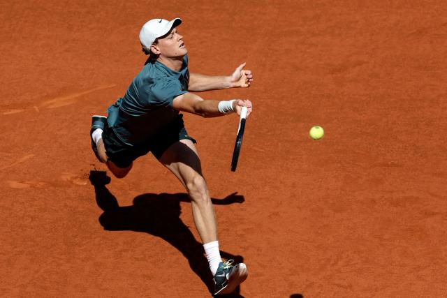 Italy's Jannik Sinner returns a ball to France's Arthur Fils during their 2026 ATP Tour Madrid Open tennis tournament semi-final singles match at the Caja Magica in Madrid, on May 1, 2026. (Photo by OSCAR DEL POZO / AFP)