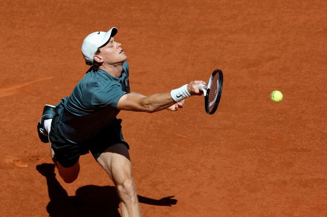 Italy's Jannik Sinner returns a ball to France's Arthur Fils during their 2026 ATP Tour Madrid Open tennis tournament semi-final singles match at the Caja Magica in Madrid, on May 1, 2026. (Photo by OSCAR DEL POZO / AFP)