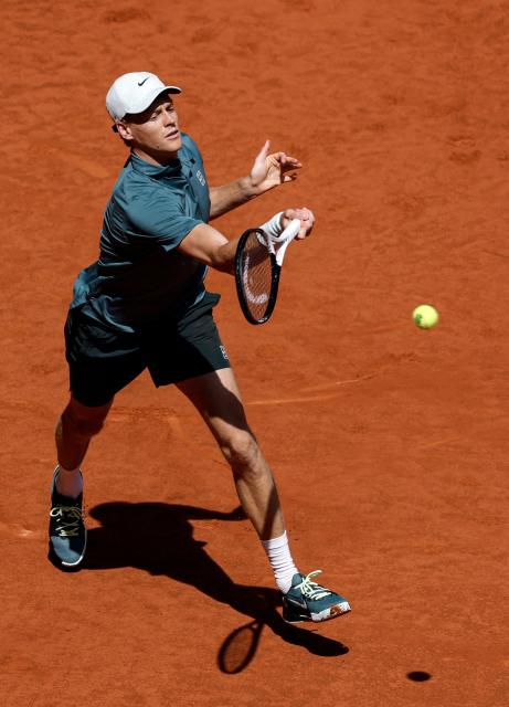 Italy's Jannik Sinner returns a ball to France's Arthur Fils during their 2026 ATP Tour Madrid Open tennis tournament semi-final singles match at the Caja Magica in Madrid, on May 1, 2026. (Photo by OSCAR DEL POZO / AFP)