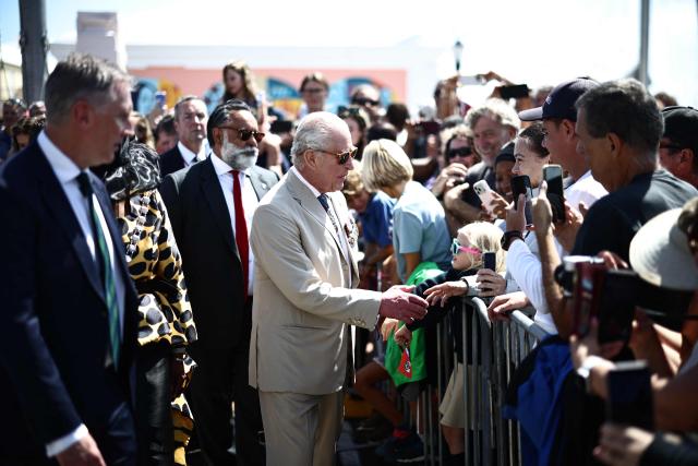 Britain's King Charles III greets members of the public during a ceremonial welcome at King's Square in St. George's, Bermuda, on May 1, 2026. King Charles III is in Bermuda for his first visit to a British Overseas Territory as Sovereign. (Photo by Henry NICHOLLS / POOL / AFP)