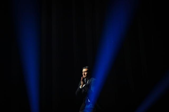 French far-right party Rassemblement National (RN) president Jordan Bardella gestures as he delivers a speech during the "Fete de la nation" meeting in Macon on May 1, 2026. (Photo by OLIVIER CHASSIGNOLE / AFP)