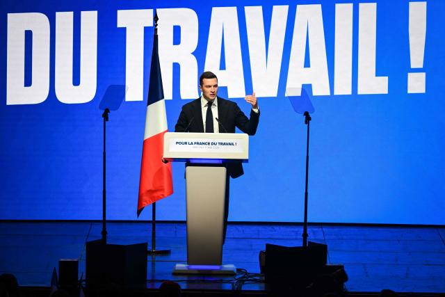 French far-right party Rassemblement National (RN) president Jordan Bardella delivers a speech during the "Fete de la nation" meeting in Macon on May 1, 2026. (Photo by OLIVIER CHASSIGNOLE / AFP)