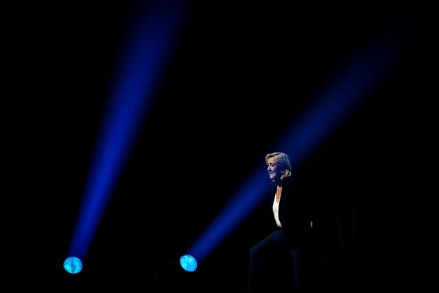 President of Rassemblement National parliamentary group Marine Le Pen arrives to deliver a speech during the "Fete de la Nation" meeting in Macon on May 1, 2026. (Photo by OLIVIER CHASSIGNOLE / AFP)