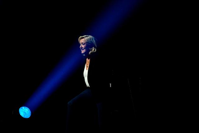 President of Rassemblement National parliamentary group Marine Le Pen arrives to deliver a speech during the "Fete de la Nation" meeting in Macon on May 1, 2026. (Photo by OLIVIER CHASSIGNOLE / AFP)