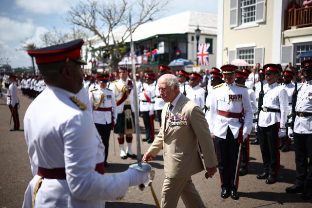 Britain's King Charles III reviews the troops during a ceremonial welcome at King's Square in St. George's, Bermuda, on May 1, 2026. King Charles III is in Bermuda for his first visit to a British Overseas Territory as Sovereign. (Photo by HENRY NICHOLLS / POOL / AFP)