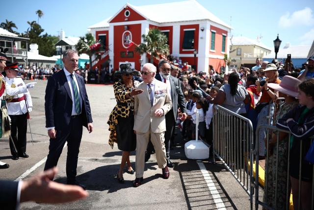 Britain's King Charles III speaks with the Mayor of St. George Quinell Francis (2L) as he greets members of the public during a ceremonial welcome at King's Square in St. George's, Bermuda, on May 1, 2026. King Charles III is in Bermuda for his first visit to a British Overseas Territory as Sovereign. (Photo by HENRY NICHOLLS / POOL / AFP)