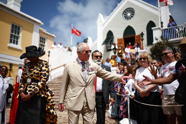 Britain's King Charles III greets members of the public as he departs St Peter’s Church during a ceremonial welcome at King's Square in St. George's, Bermuda, on May 1, 2026. Also pictured, Mayor of St. George Quinell Francis (L). King Charles III is in Bermuda for his first visit to a British Overseas Territory as Sovereign. (Photo by HENRY NICHOLLS / POOL / AFP)