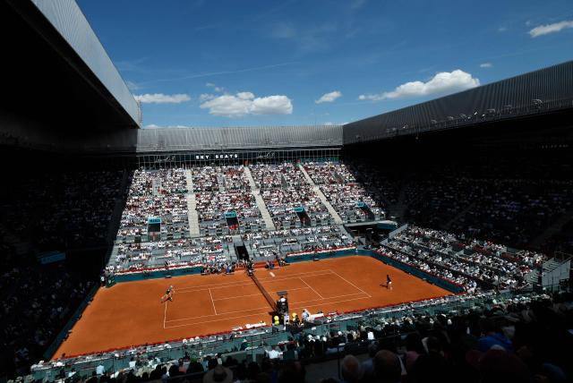 Italy's Jannik Sinner (L) serves to France's Arthur Fils during their 2026 ATP Tour Madrid Open tennis tournament semi-final singles match at the Caja Magica in Madrid, on May 1, 2026. (Photo by Oscar DEL POZO / AFP)