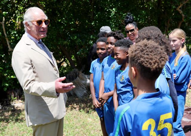 Britain's King Charles III speaks with students during a visit to a ‘Living Classroom’ on Trunk Island on May 1, 2026 in Hamilton, Bermuda. King Charles III is in Bermuda for his first visit to a British Overseas Territory as Sovereign. (Photo by Chris Jackson / POOL / AFP)