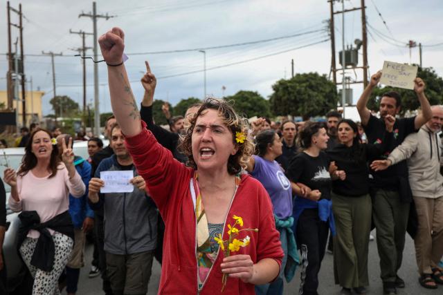 Members of the Global Sumud Flotilla vessels, intercepted by the Israeli Navy in international waters, demonstrate in the town of Ierapetra in the island of Crete, Greece, on May 1, 2026. (Photo by Costas METAXAKIS / AFP)