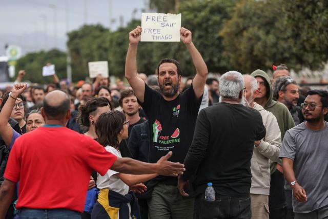 Members of the Global Sumud Flotilla vessels, intercepted by the Israeli Navy in international waters, demonstrate in the town of Ierapetra in the island of Crete, Greece, on May 1, 2026. (Photo by Costas METAXAKIS / AFP)