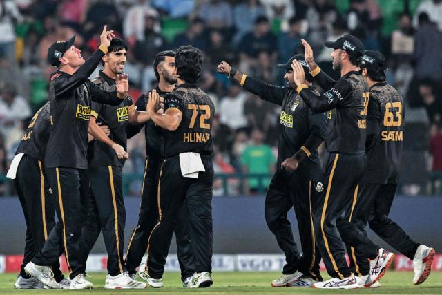 Hyderabad Kingsmen's players celebrate after the dismissal of Islamabad United's Pakistani cricket player Sameer Minhas during the Pakistan Super League (PSL) Twenty20 second Eliminator match between Hyderabad Kingsmen and Islamabad United at the Gaddafi Stadium in Lahore on May 1, 2026. (Photo by Arif ALI / AFP)