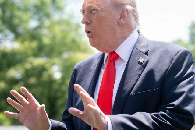 US President Donald Trump stops to speak to reporters before boarding Marine One as he departs from the South Lawn of the White House in Washington, DC, on May 1, 2026. Trump is going to Florida to speak at an event at The Villages and to attend the Forum Club of the Palm Beaches dinner. (Photo by SAUL LOEB / AFP)