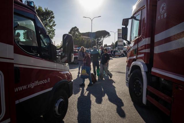 Residents wait to return to their houses after being evacuated because of a wildfire, in Asciano on May 1, 2026. Italian authorities evacuated some 3,500 people in its famed Tuscany region on May 1, 2026 as they try to tame a wildfire that has been raging for more than 24 hours. Over 800 hectares (nearly 2,000 acres) have been ravaged by the fire in the mountains between the historic cities of Lucca and Pisa. (Photo by Federico SCOPPA / AFP)