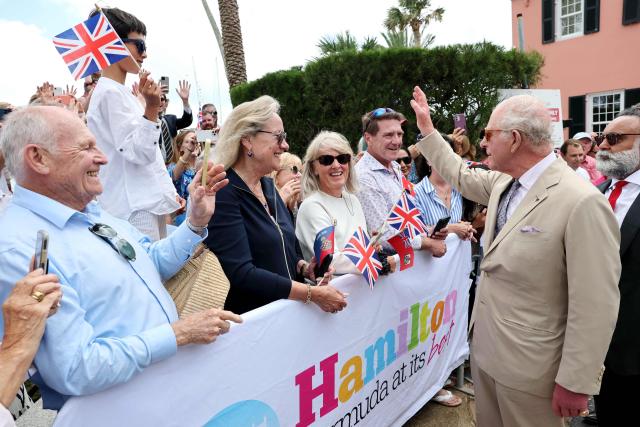 Britain's King Charles III greets people at the Royal Bermuda Yacht Club in Hamilton, Bermuda, on May 1, 2026. King Charles III is in Bermuda for his first visit to a British Overseas Territory as Sovereign. (Photo by Chris Jackson / POOL / AFP)