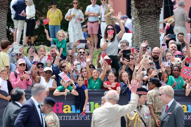 Britain's King Charles III waves to the crowd at the Royal Bermuda Yacht Club in Hamilton, Bermuda, on May 1, 2026. King Charles III is in Bermuda for his first visit to a British Overseas Territory as Sovereign. (Photo by Chris Jackson / POOL / AFP)