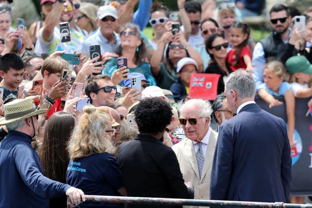 Britain's King Charles III greets people at the Royal Bermuda Yacht Club in Hamilton, Bermuda, on May 1, 2026. King Charles III is in Bermuda for his first visit to a British Overseas Territory as Sovereign. (Photo by Chris Jackson / POOL / AFP)