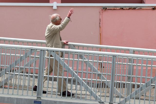 Britain's King Charles boards a ferry in Hamilton, Bermuda, on May 1, 2026. King Charles III is in Bermuda for his first visit to a British Overseas Territory as Sovereign. (Photo by Suzanne Plunkett / POOL / AFP)