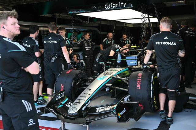 Technicians work on the car of Mercedes' Italian driver Kimi Antonelli in the garage during a practice session for the 2026 Miami Formula One Grand Prix at Miami International Autodrome in Miami Gardens, Florida, on May 1, 2026. (Photo by CHANDAN KHANNA / AFP)