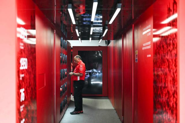 Ferrari's French team principal Frederic Vasseur looks at his phone in a hallway leading to the Ferrari team garage during a practice session for the 2026 Miami Formula One Grand Prix at Miami International Autodrome in Miami Gardens, Florida, on May 1, 2026. (Photo by CHANDAN KHANNA / AFP)