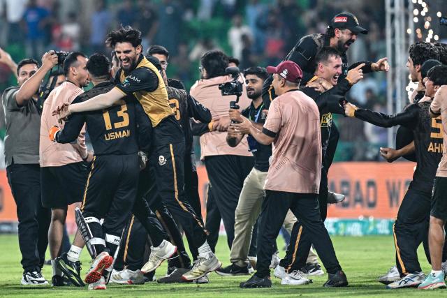 Hyderabad Kingsmen's players celebrate their win in the Pakistan Super League (PSL) Twenty20 second Eliminator match against Islamabad United at the Gaddafi Stadium in Lahore on May 1, 2026. (Photo by Arif ALI / AFP)