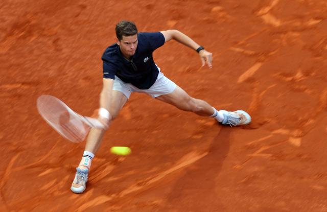 Belgium's Alexander Blockx returns the ball to Germany's Alexander Zverev during their 2026 ATP Tour Madrid Open tennis tournament semi-final singles match at the Caja Magica in Madrid, on May 1, 2026. (Photo by Thomas COEX / AFP)
