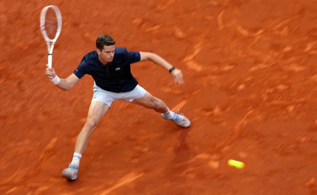 Belgium's Alexander Blockx returns the ball to Germany's Alexander Zverev during their 2026 ATP Tour Madrid Open tennis tournament semi-final singles match at the Caja Magica in Madrid, on May 1, 2026. (Photo by Thomas COEX / AFP)