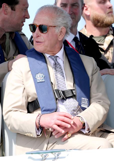 Britain's King Charles III onboard the Coast Guard’s console boat during a Coast Guard briefing on May 1, 2026 in Hamilton, Bermuda. King Charles III is in Bermuda for his first visit to a British Overseas Territory as Sovereign. (Photo by Chris Jackson / POOL / AFP)
