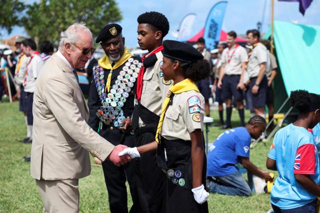 Britain's King Charles meets with scouts at Royal Naval Dockyard in Sandys Parish, Bermuda, May 1, 2026. King Charles III is in Bermuda for his first visit to a British Overseas Territory as Sovereign. (Photo by Suzanne Plunkett / POOL / AFP)