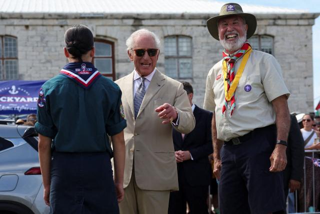 Britain's King Charles meets with scouts at Royal Naval Dockyard in Sandys Parish, Bermuda, May 1, 2026. King Charles III is in Bermuda for his first visit to a British Overseas Territory as Sovereign. (Photo by Suzanne Plunkett / POOL / AFP)